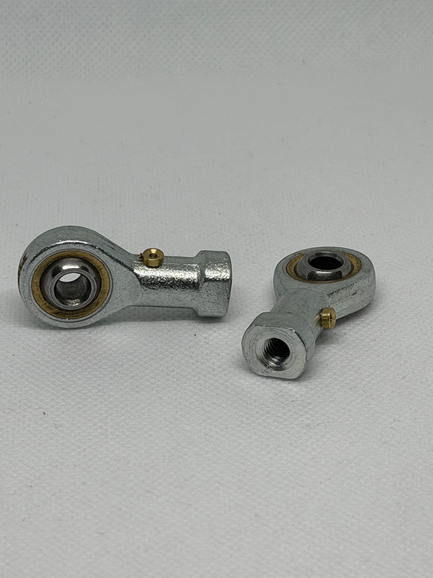 SpringFixUk M6 female rod end bearings with 6mm bore, steel construction, and right-hand thread for smooth motion in machinery.
