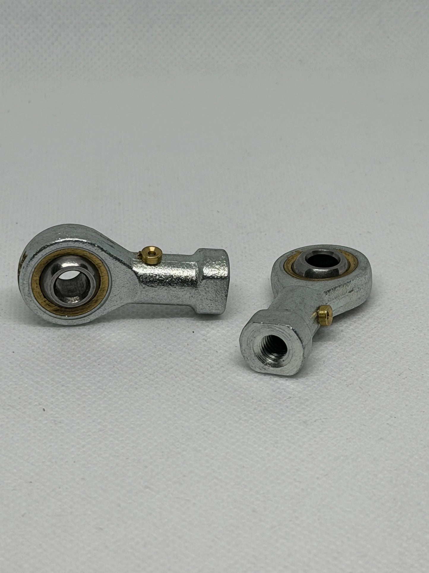 SpringFixUk M6 female rod end bearings with 6mm bore, steel construction, and right-hand thread for smooth motion in machinery.