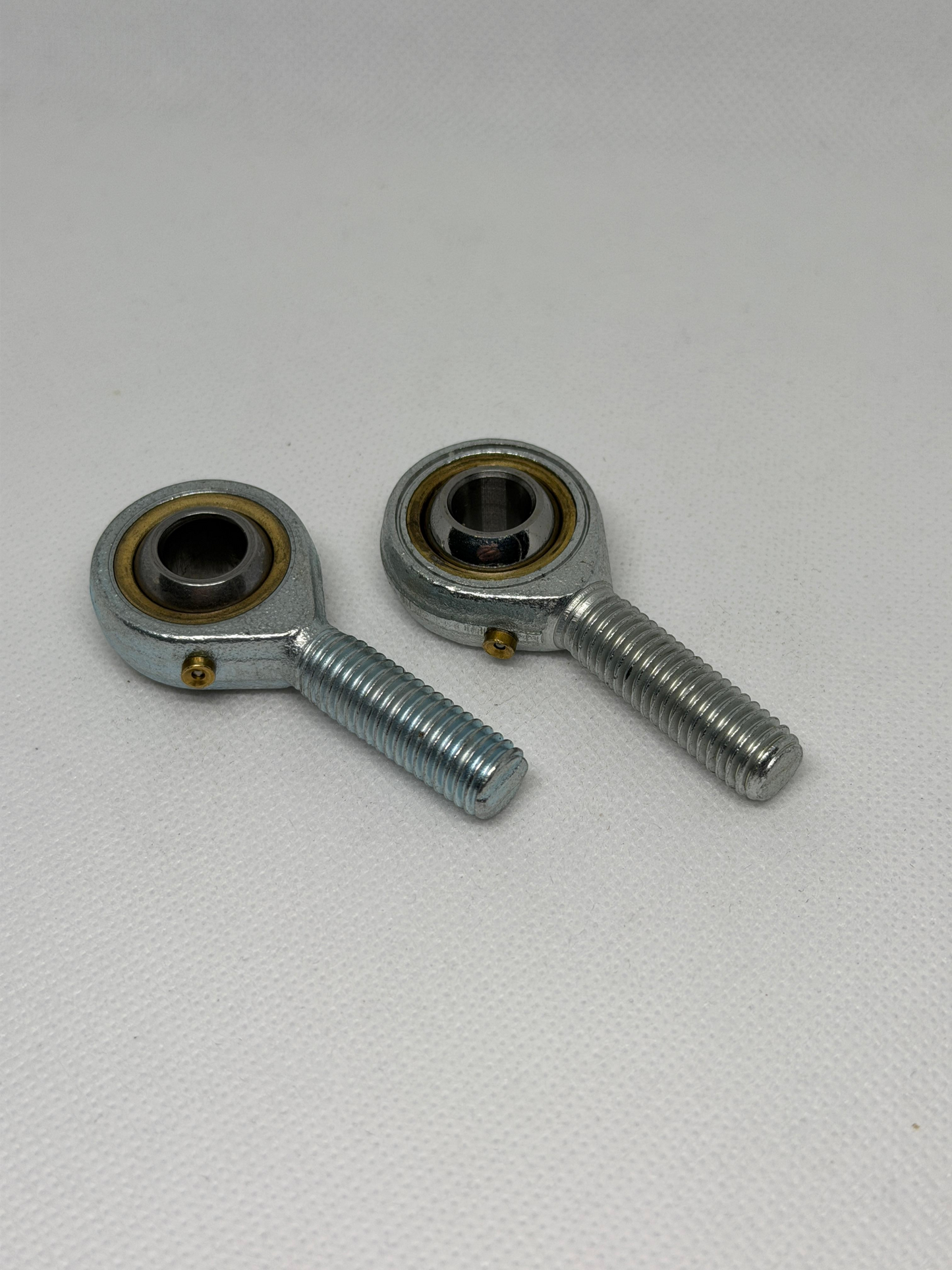 SpringFixUK pair of POS10 M10 male rod end bearings with 10mm bore, steel construction, zinc-plated finish.