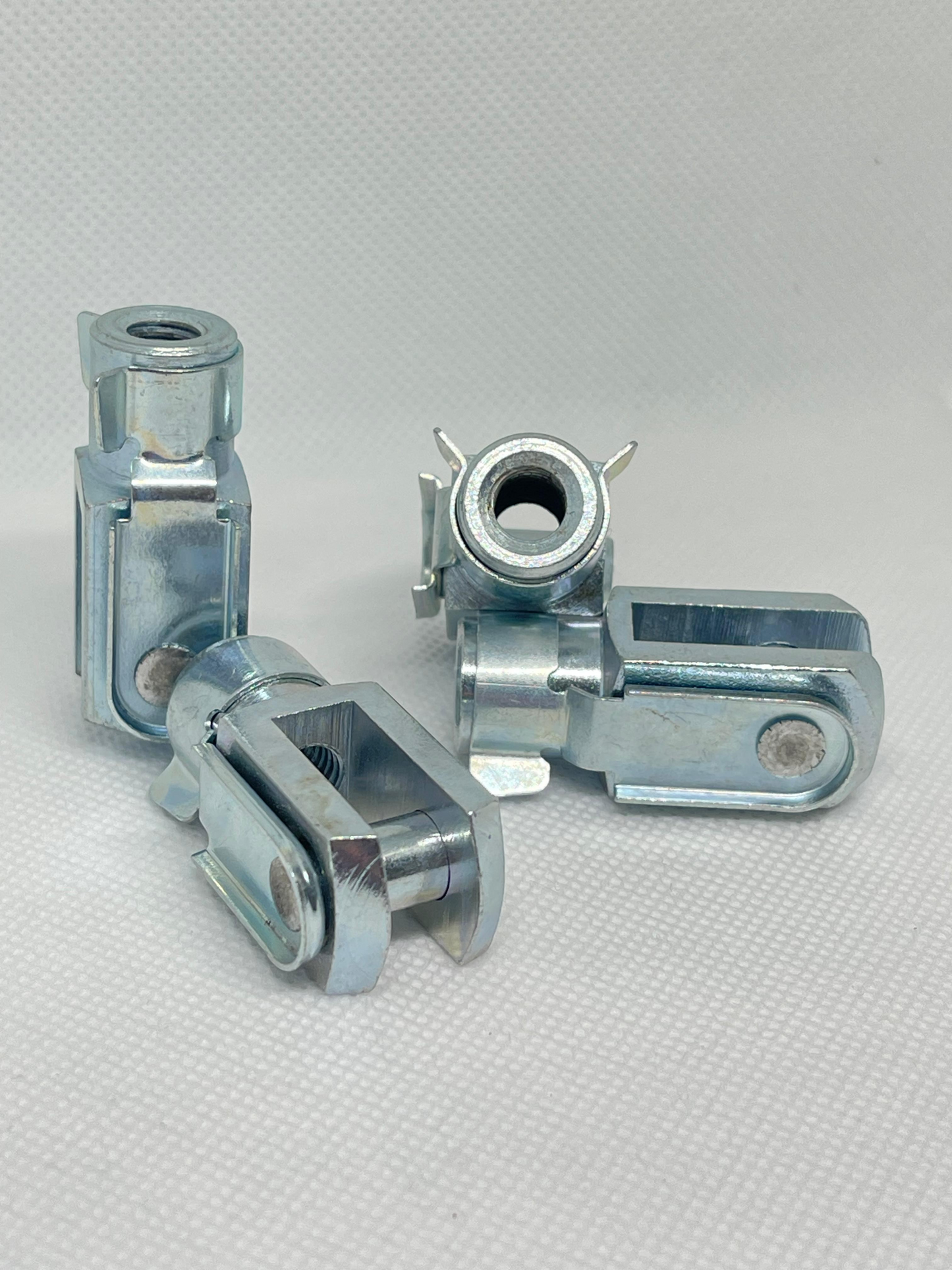 SpringFixUk M10 zinc plated steel clevis fork ends with spring clips, DIN 71752 standard, for gas struts and linkages.