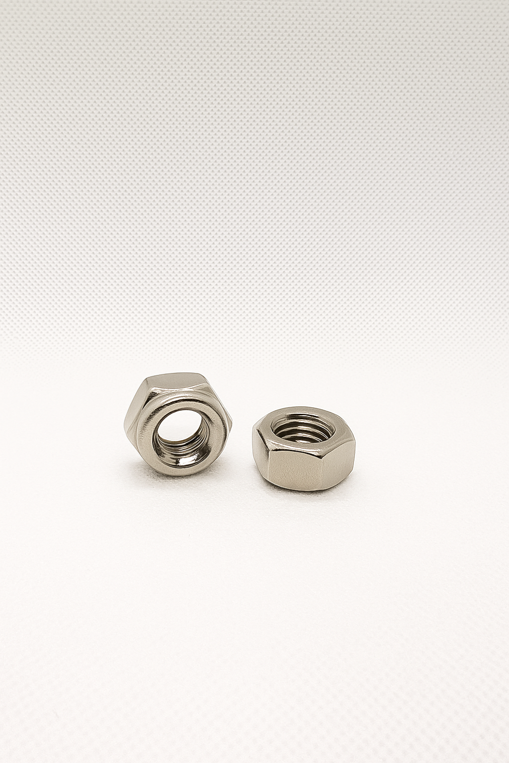 SpringFixUk M6 A2 stainless steel hex nuts, DIN 934 standard, corrosion resistant, ideal for machinery and outdoor use.