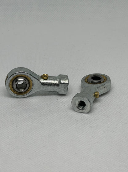 SpringFixUk M6 female rod end bearings with 6mm bore, steel construction, and right-hand thread for smooth motion in machinery.